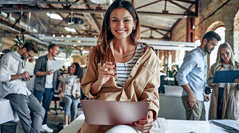 Group of young multiracial business people are working in modern office. Freelancers in coworking place. Creative and stylish youth.